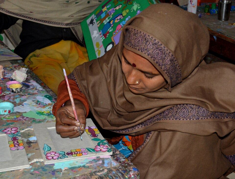 A Mithila artist at work on a painting